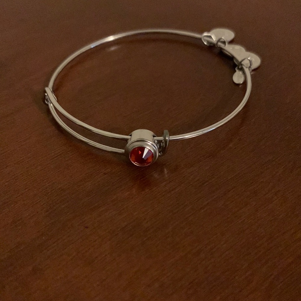 Alex and Ani silver bangle with orange stone
